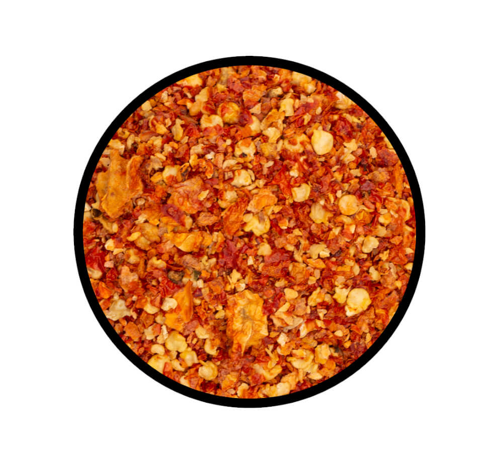Bhut Jolokia Chili geschrotet - Detaillierte Nahaufnahme der Textur / Struktur