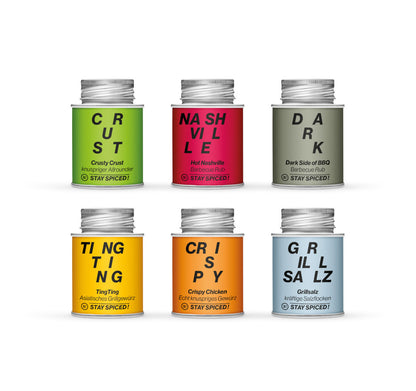 Die sechs bunten STAY SPICED ! Gewürzdosen der Tom Heinzle OUTDOOR Geschenkset Kollektion in der Frontalansicht